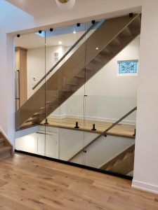 Modern glass railings installed on a Toronto balcony, enhancing the home’s curb appeal and resale value.