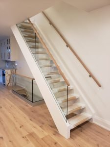 Modern interior glass staircase railing installation in Toronto home by Belka Glass