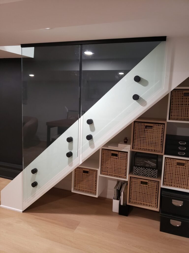 Basement glass railing with standoffs in Midtown Toronto home by Belka Glass
